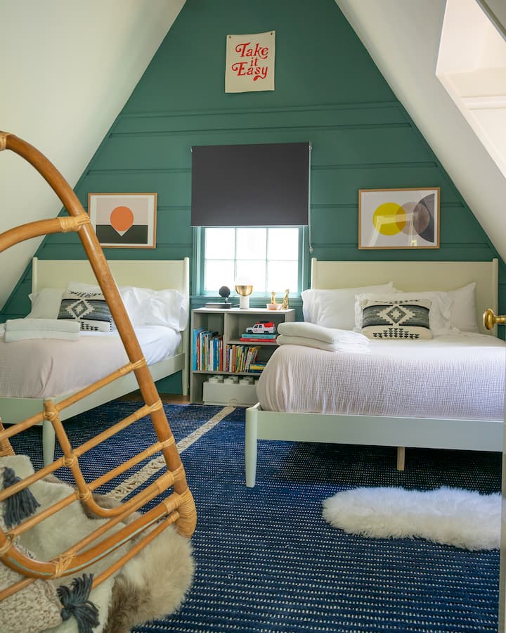 Upstairs bedroom with the most comfortable beds and pillows perfect for a late sleep in and wake up to views of the forest.