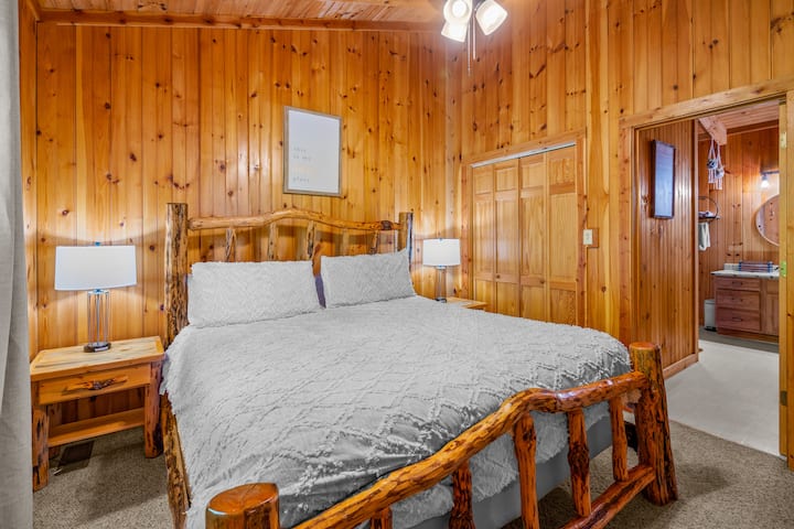 Upstairs King in suite bedroom with attached bathroom with shower.