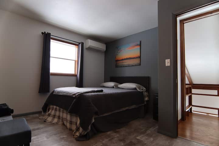 Bedroom  #2 with queen bed and second story views