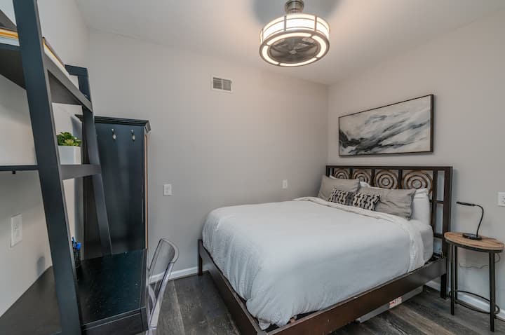 Studio Suite features a queen bed with small desk, night table, and its own washer/dryer.