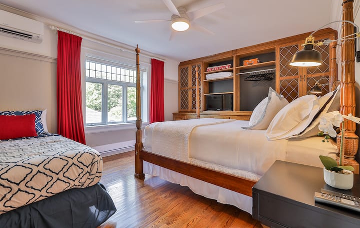 The Library Bedroom (2nd floor)
Gorgeous historic library bedroom features Queen-size poster bed, additional sleeper sofa (made into single bed on request), hardwood floors, large windows, built-in hanging closet, 40" TV. Optional crib on request.