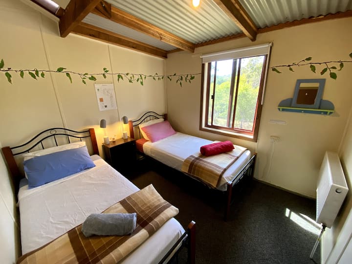 Bedroom three - with two single beds and an easterly window