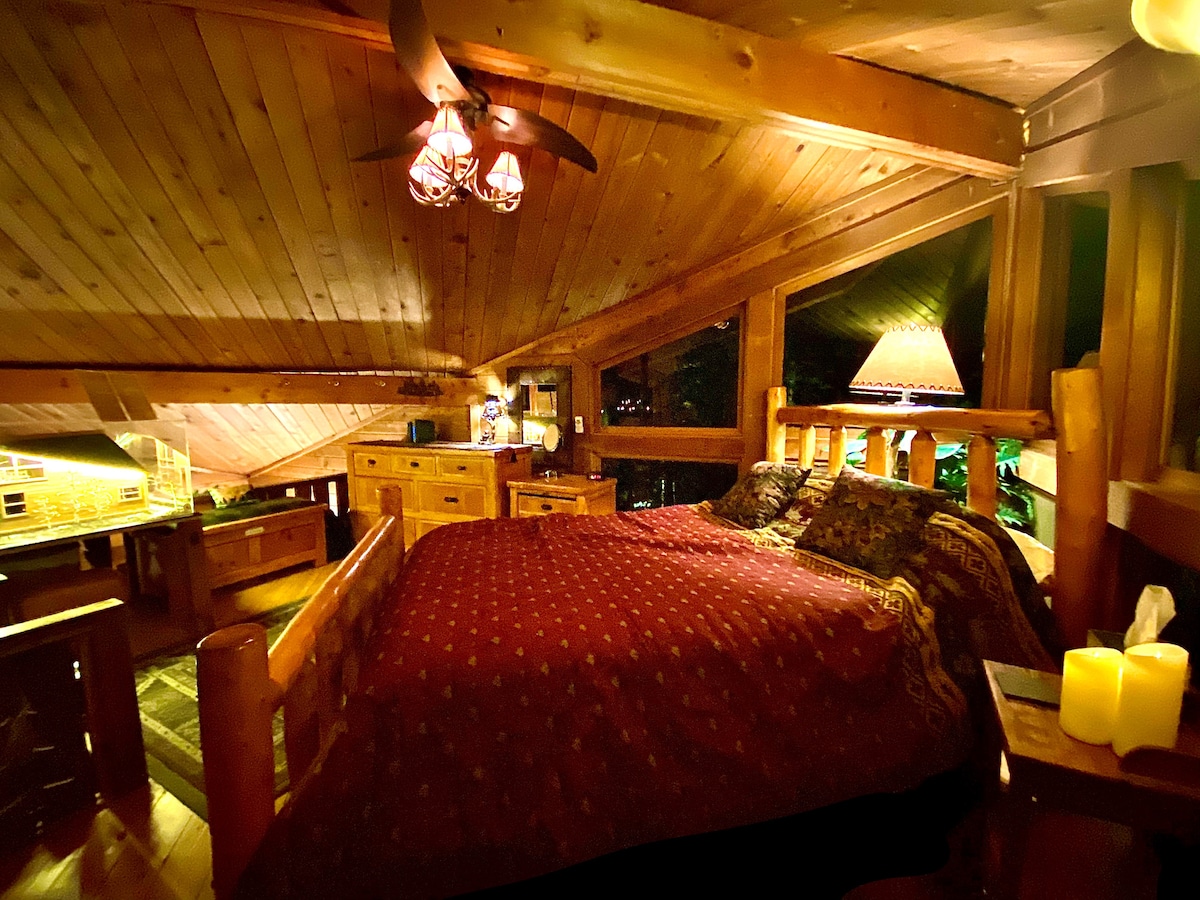 Master Loft Upstairs in the Cabin!  It's an incredibly atmospheric space!   The space can lit by just electronic candles if you want ;-). Super romantic.  You can even see the river from your bedroom…
