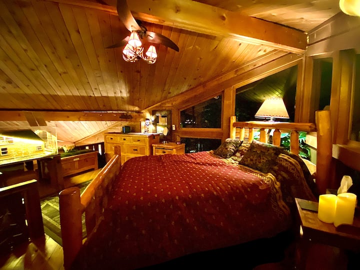 Master Loft Upstairs in the Cabin!  It's an incredibly atmospheric space!   The space can lit by just electronic candles if you want ;-). Super romantic.  You can even see the river from your bedroom…