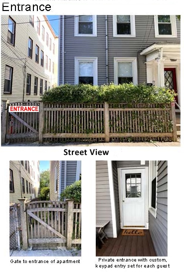 A private entrance to the apartment is showcased, featuring a wooden gate set within a fenced area. The entrance is well-defined, accessed via a clean path leading to the door, which displays a welcome sign. The surrounding greenery adds a touch of nature.
