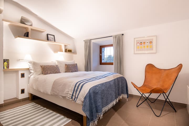 The Merckx bedroom with a full en-suite bathroom. This room also has space for a cot