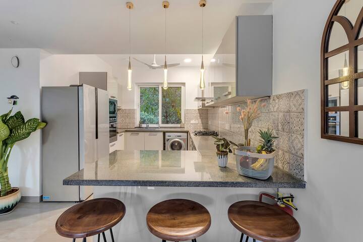 Fully equipped kitchen with a fridge, freezer, oven, microwave