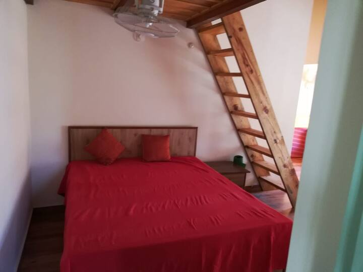 The Lake View Suite. The room has 1 double bed, 1 single bed and a loft with sleeping arrangement for 1-2 person and an attached bath.