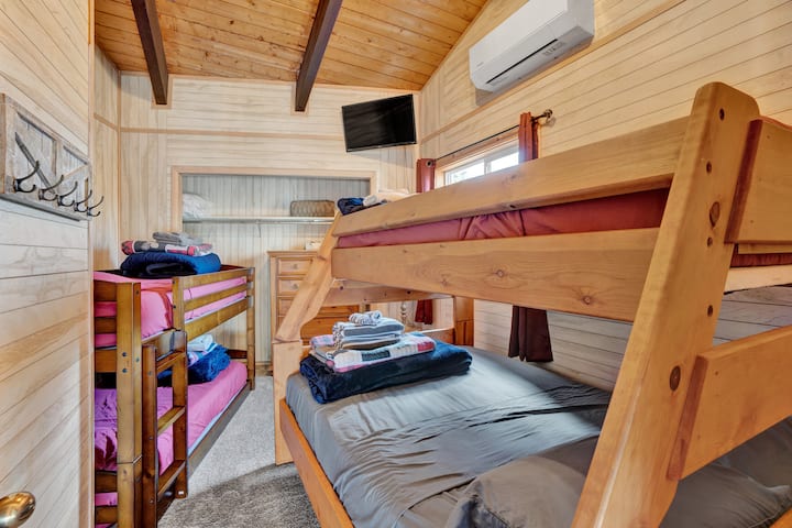 Second Floor - Bedroom 5 -  Twin over twin Bunk bed and Twin over Full bunk bed with 32 inch Roku Smart TV and vaulted ceilings. Mini-split heating and AC.