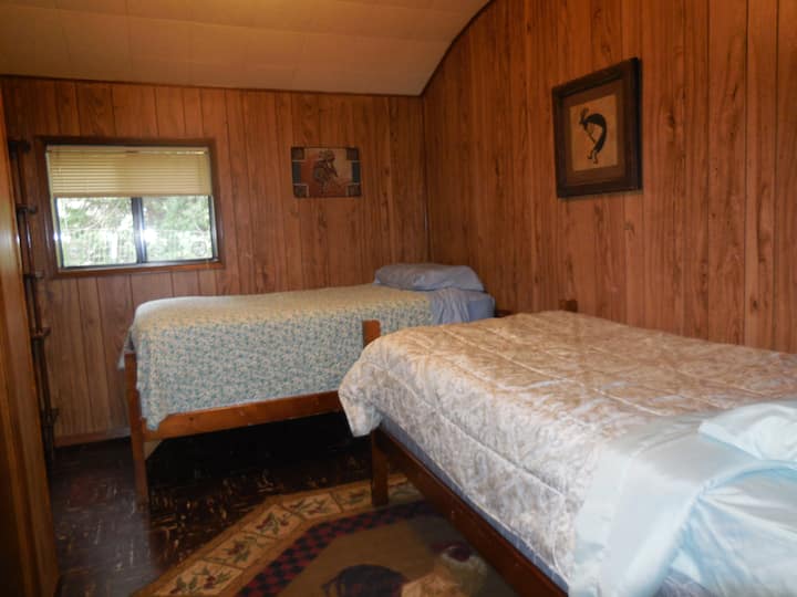 Another view of the tricksters room. This room is off the mud room and up one step. This room is small doesn't have nightstands but there is a 2 drawer dresser