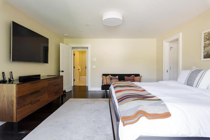 Primary bedroom with king bed, fold down couch for kids and twin sized trundle bed stored underneath the main bed. Down comforter and Pendleton blanket will keep you warm and  down and Tempurpedic pillows will keep you comfortable. 