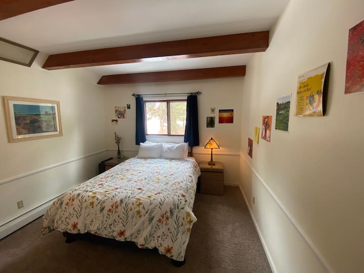 Ponderosa Pine Room in sunlight, on Guest Home main level. The main level bathroom is adjacent.
  Panorama photo. See next photos for better proportions and other views.