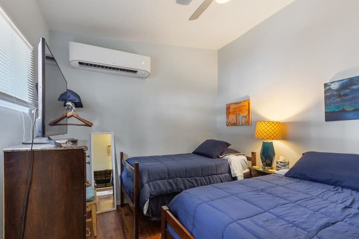 The bedroom has a door that locks for privacy w/ 2 twin beds and Smart TV