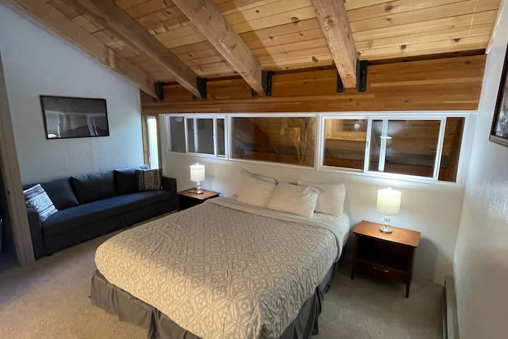 Spacious master bedroom has California King hotel memory-foam mattress, queen size sofa bed, and nice Drexel mid-century night stands. New for 2023: sliding dual-pane windows for privacy and keep living room noise out of bedroom.