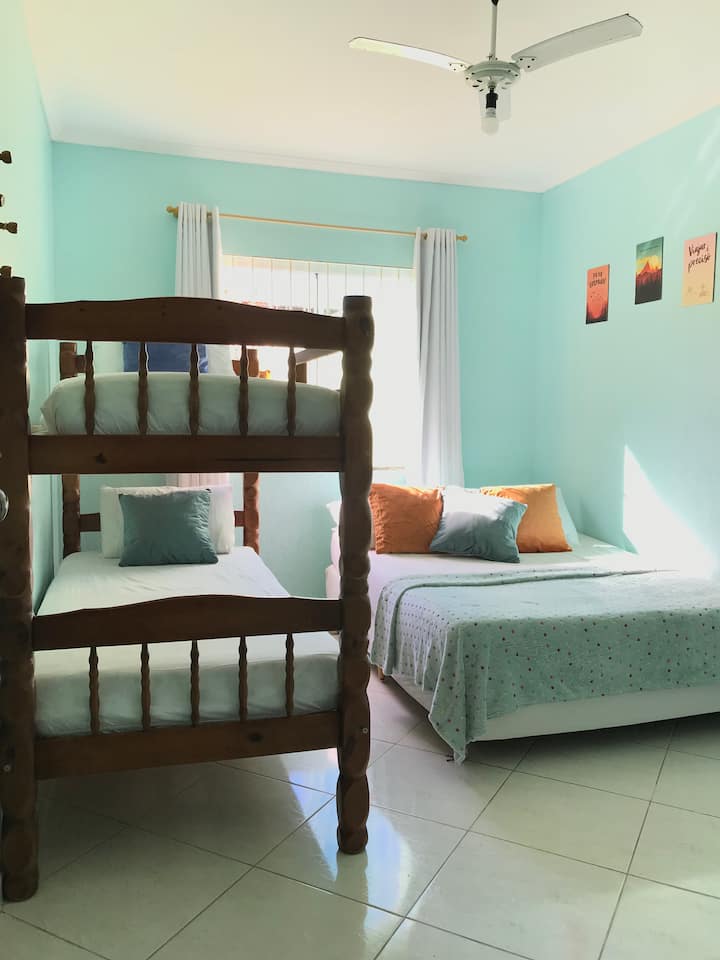 Suite, with 1 double bed, and 1 bunk bed (2 single beds). As shown. Ceiling fan, and curtain on the window.