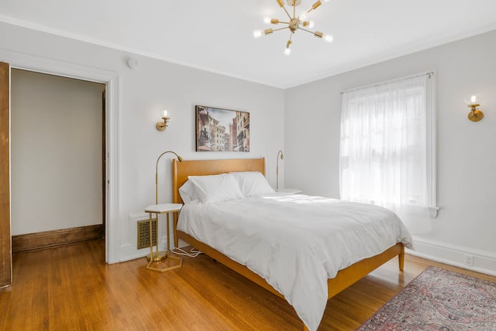 Bedroom 1 offers comfortable queen size bed, private ensuite bathroom, shift robe with hangers and drawers, dedicated iron and ironing board, luggage rack, towel rack and study/work area.