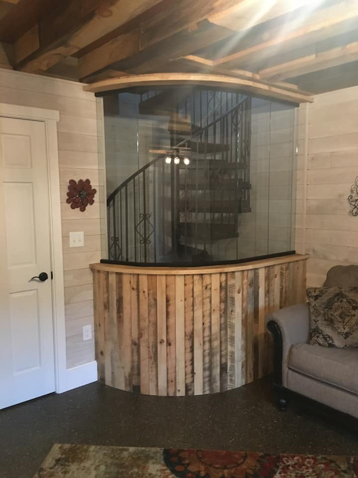 Spiral staircase that leads to up to main level.