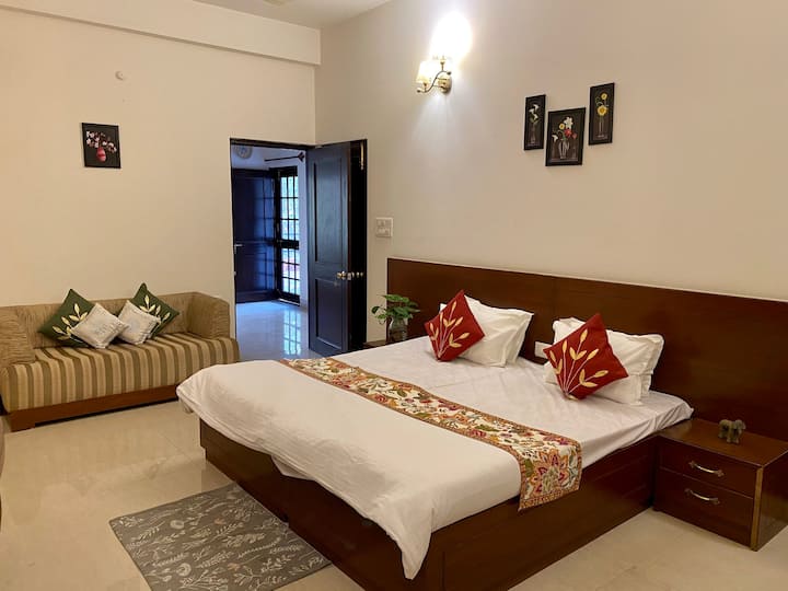 The second bedroom has a cozy seating with all amenities and an attached bathroom.