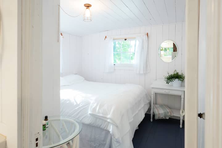 We provide organic luxury bamboo bed sheets, a memory foam topper and four pillows in this queen sized bed. In addition, there is a vintage, almost full sized pull down Murphy bed built into the living room wall.