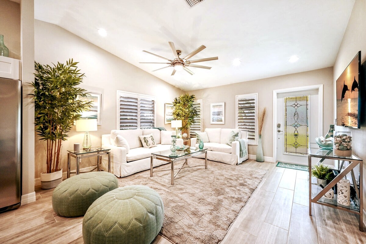 Beautiful and relaxing living Room with high cathedral ceiling and 60" wall mounted smart TV. The sofa is a pull out bed