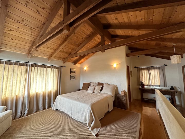 In the Guest Wing is the Upstairs Suite. It has an ocean view , King bed,  800-thread count linens. fireplace and bathroom en suite. 