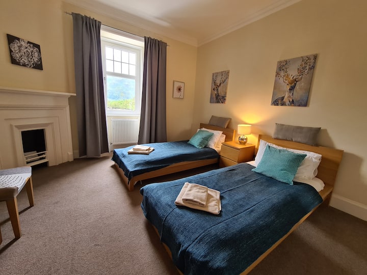 One of the three twin bedrooms