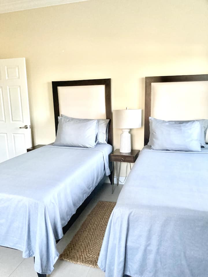Twin beds with option to convert to king bed.