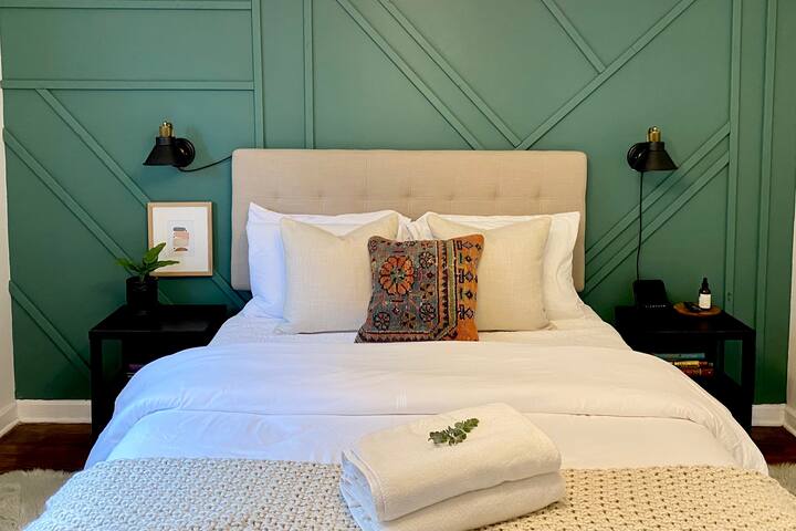 The green bedroom has such a cozy serene feel.  This room also has a roku tv.
