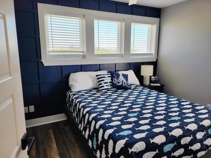 Second floor, NE Bedroom with queen bed.  This room has a 55" Smart TV and lots of natural light!