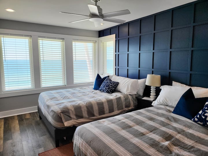 Second floor SW bedroom has 2 queen beds, a 55" Smart TV and beautiful views!