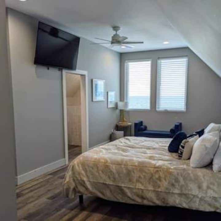 Primary Bedroom, located on the 3rd floor, beautiful views of the beach and gulf, 55" Smart TV.