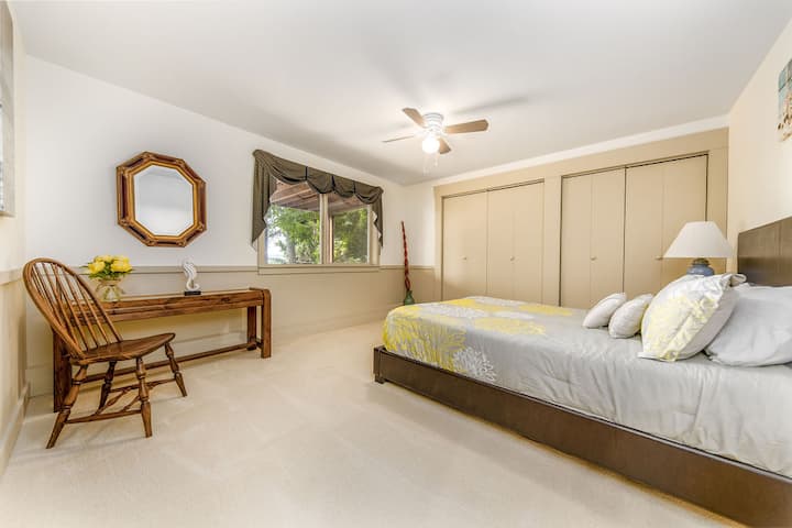Guest bedroom on ground level with queen bed.