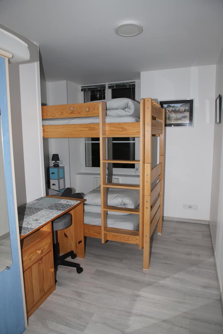 Bunk beds, a desk, a wardrobe