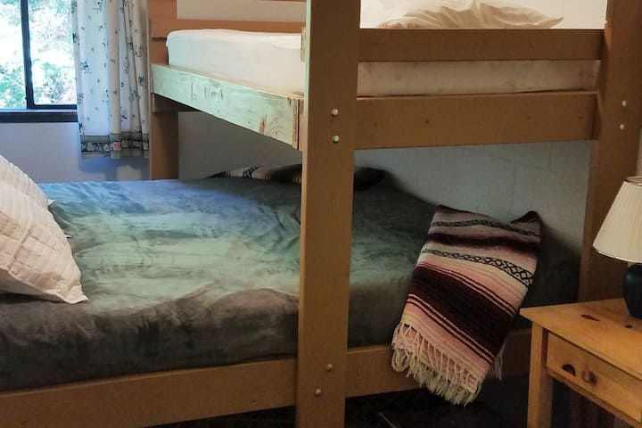 Room 18- One King Bed and One twin. Set up as a bunk Bed.