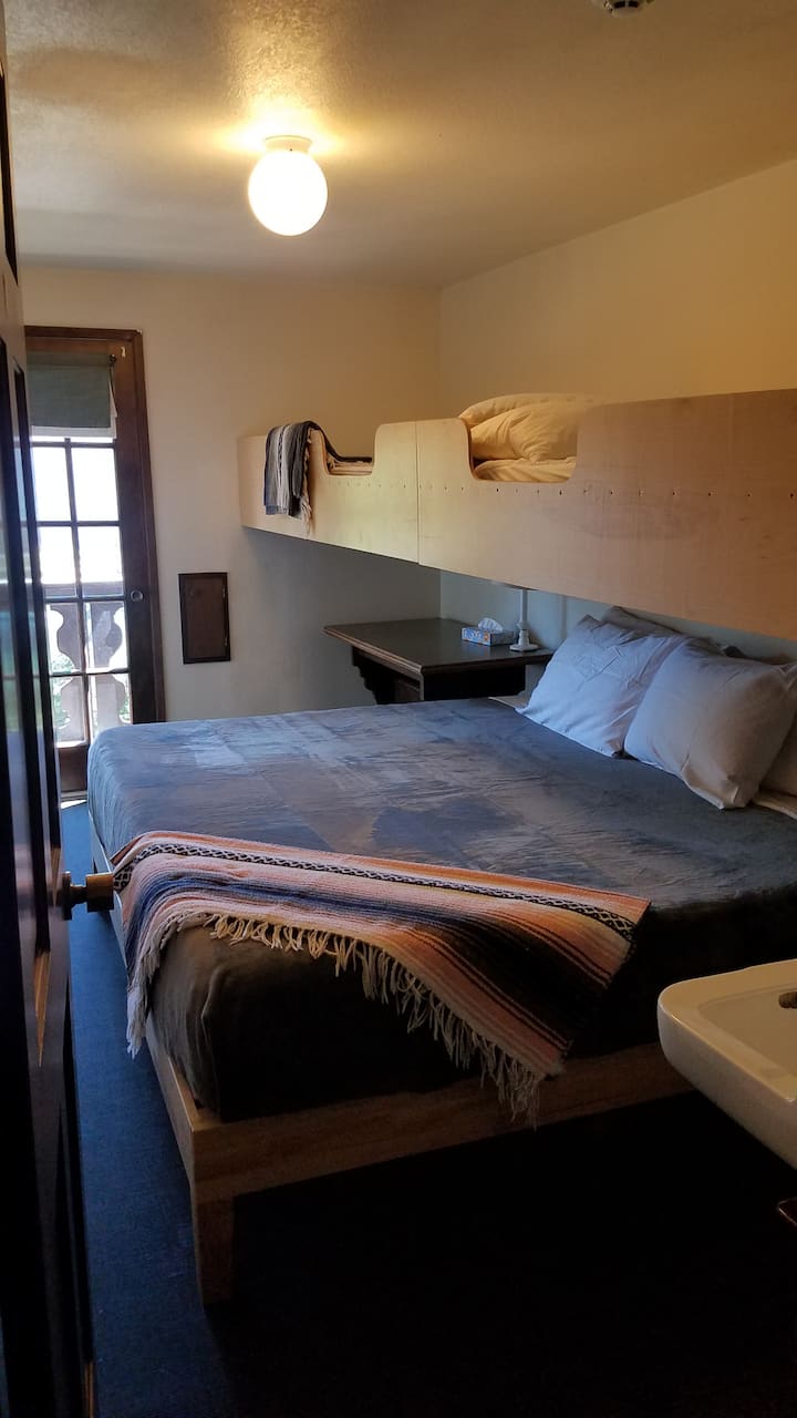 Room 15- One King Bed and two Twins. This room has a balcony and a sink.