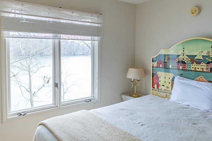 Upstairs lake view queen bedroom with three closets all with twin mattress. This room can sleep 5 people.  (Bedroom 2)