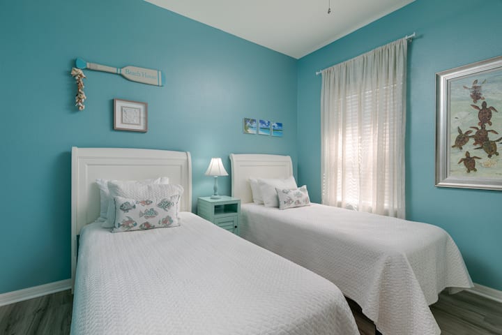 Rest peacefully in the room with two twin beds, providing a cozy and inviting atmosphere for a restful night's sleep.
