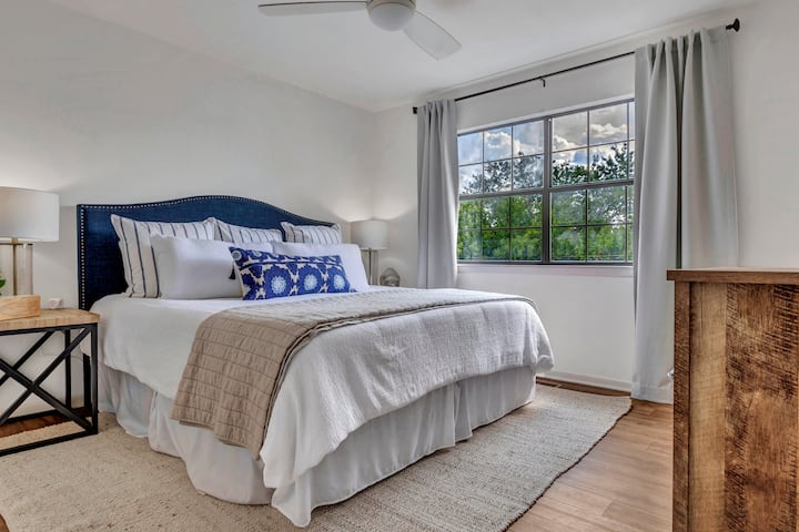 The master upstairs (King Size bed) provides large closet, soft linens, double vanity/desk, bedside lamps, beside USB pods, & ceiling fan. 