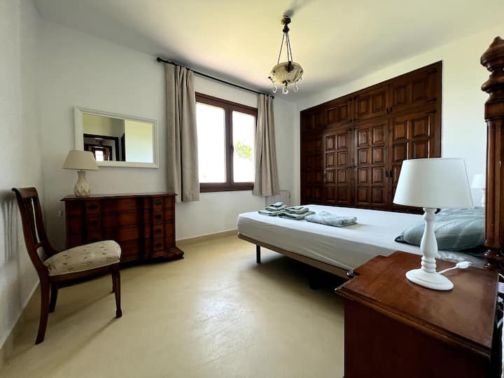 Double master bedroom with bathroom and ocean view.