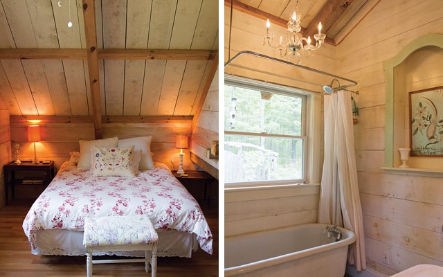 A quaint sleeping area features a floral-patterned comforter on a spacious bed, positioned against wood-paneled walls. Soft lighting is provided by bedside lamps, creating a cozy ambiance. Adjacent, a serene bathroom is highlighted by a freestanding tub and natural light entering through the window.