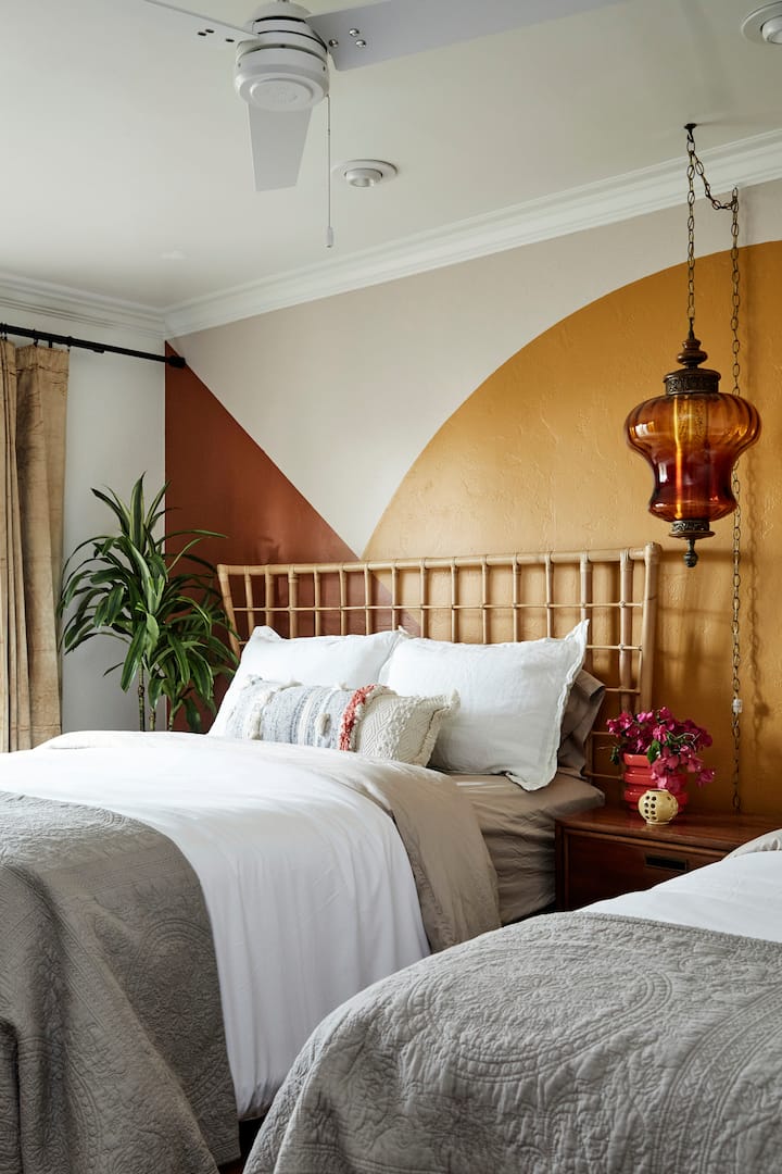 Sunlight shines through a set of French doors from the bedroom, which lead to your own private patio.
