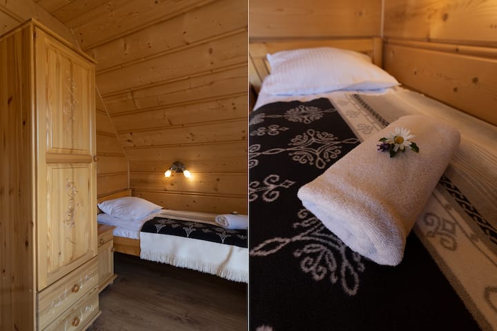 bedroom 2 with balcony, equipped with double and single bed, anti-allergic bedding, white cotton sheets, bath towels, wardrobe for clothes with hangers and shelves