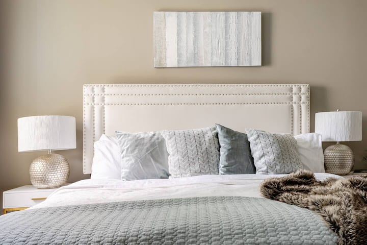 Guest bedroom with king bed, large closet, with full bathroom directly across from bedroom.