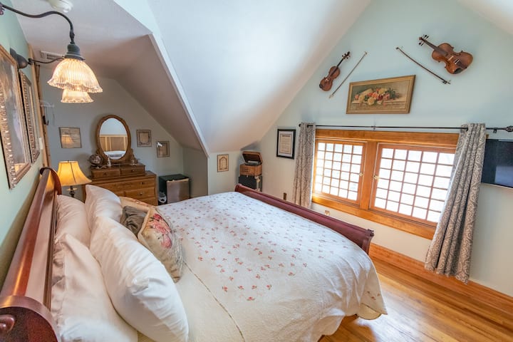 The large swing-in windows look out over the historic homes in Deadwood's Presidential District, with pine-covered hills enclosing the neighborhood.