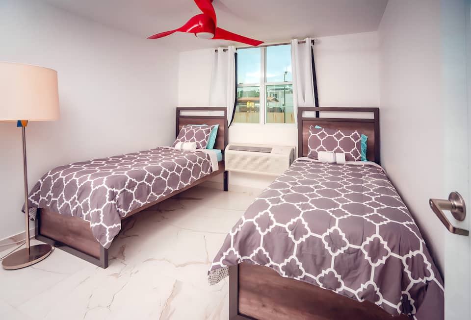 Condo bedroom with two twin beds