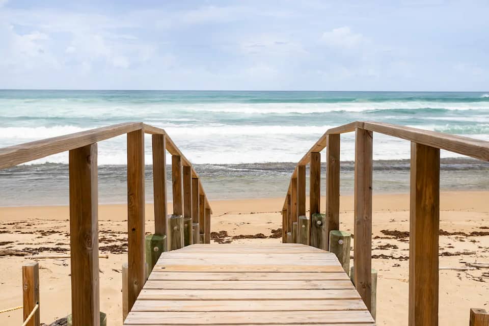 Wooden beach walkway leading to the ocean