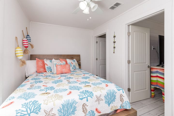 Bedroom Two is off of the living room and has a queen bed.