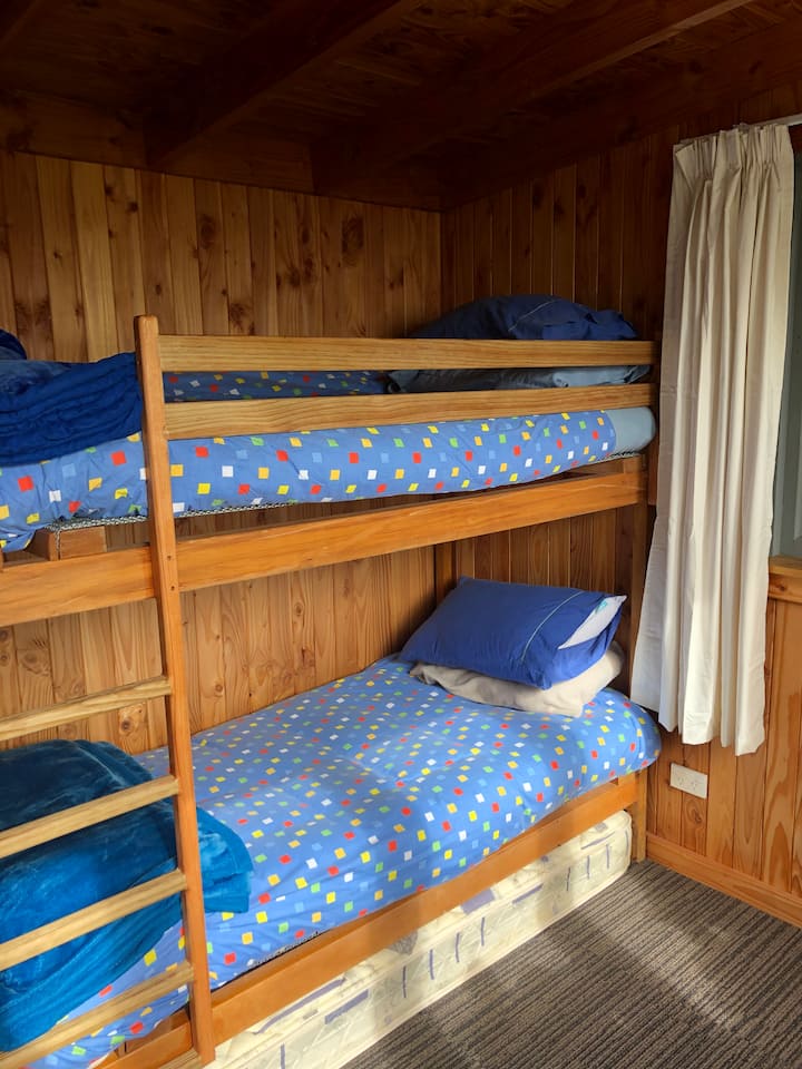 Set of bunks in the sleepout available.  Suitable for children or teenagers.  Sleepout has its own toilet and hand basin.  It is situated close to the house