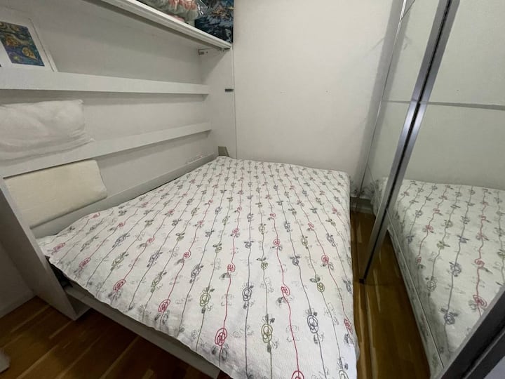 Guest room with double bed ( horizontal bedside - wall mounted). In this photo, the bed is open.