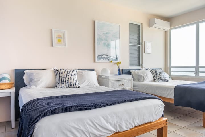 Double Queen Bedroom with jaw dropping ocean views. (Second BR)
Reflects typical sunny ocean views but bedding has been updated with crisp white sheets and premium navy blankets.